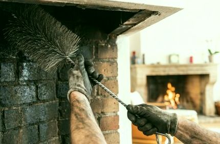 Round brush passed through a firebox on a climb-through